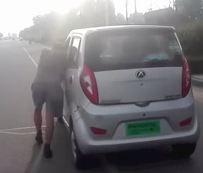 man pushing a car is actual physical control